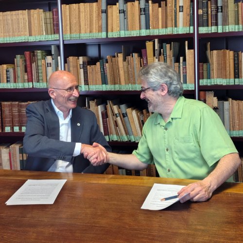 Signing the inauguration of a library collection on tripe and offal